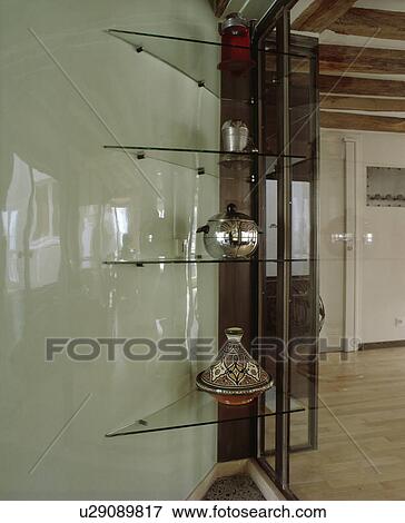 Stock Photo - Close-up of triangular glass shelves. Fotosearch
