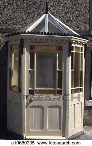Stock Photography - Close up of Victorian porch with stained glass windows. Fotosearch