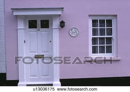 Close up of white front door and windowframe on pastel pink traditional house View Large Photo Image Stock Photography - Close up of white front door and windowframe on pastel pink traditional house. Fotosearch