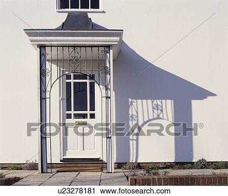 Close-up of white front door with Regency porch View Large Photo Image Stock Image - Close-up of white front door with Regency porch. Fotosearch