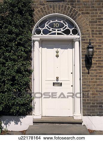 Picture - Close-up of white Georgian front door. Fotosearch