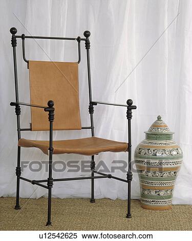 Close-up of wrought iron and leather chair View Large Photo Image Stock Photography - Close-up of wrought iron and leather chair. Fotosearch