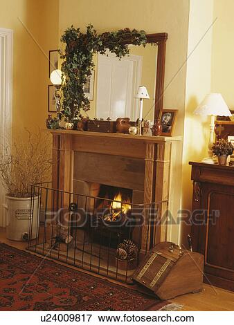 Closeup of fireplace with large mirror over decorated for Christmas. View Large Photo Image Stock Photo - Closeup of fireplace with large mirror over decorated for Christmas.. Fotosearch