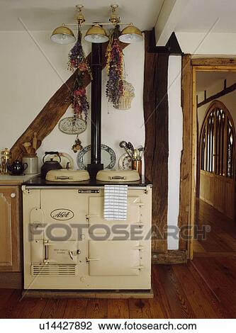 Cream Aga in cottage kitchen View Large Photo Image Stock Image - Cream Aga in cottage kitchen. Fotosearch