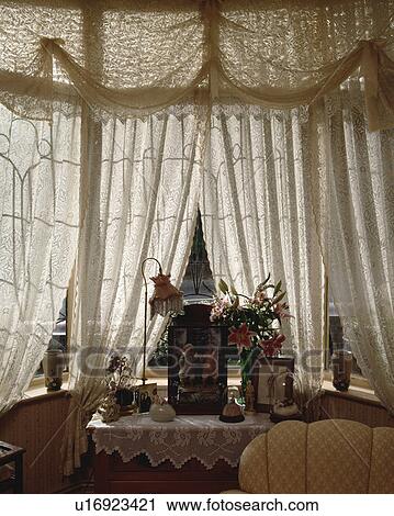 Cream lace curtains on window View Large Photo Image Stock Image - Cream lace curtains on window. Fotosearch