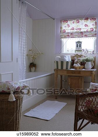 Cream panelling and rose patterned blind in traditional pastel mauve bathroom with cream carpet View Large Photo Image Stock Image - Cream panelling and rose patterned blind in traditional pastel mauve bathroom with cream carpet. Fotosearch