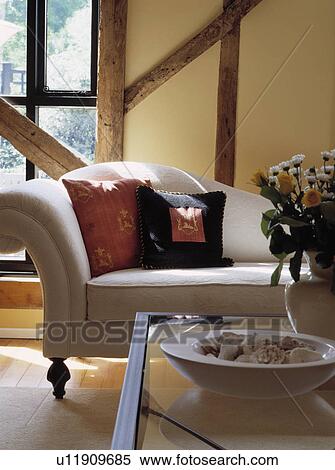 Stock Photography - Cream sofa in traditional living room. Fotosearch