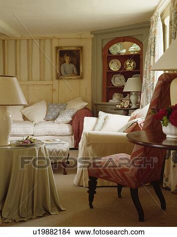 Stock Photo Of Cream Sofas In Small Cottage Living Room Cream Sofas In Small Cottage Living Room