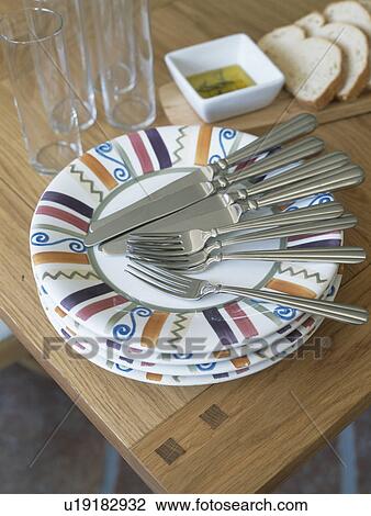 Cultery on patterned plates View Large Photo Image Stock Image - Cultery on patterned plates. Fotosearch