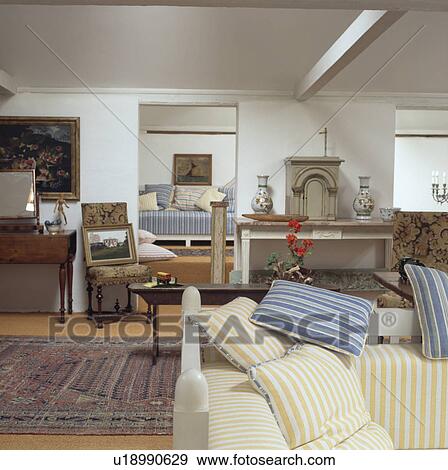 Cushions on sofa in traditional living room View Large Photo Image Stock Photo - Cushions on sofa in traditional living room. Fotosearch