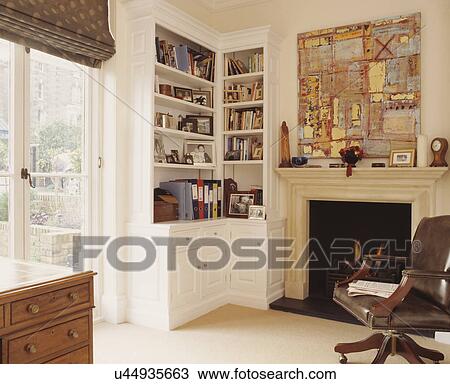 Custom-built to fit storage unit in corner of small room provides space to hide away work when not needed. View Large Photo Image Stock Image - Custom-built to fit storage unit in corner of small room provides space to hide away work when not needed.. Fotosearch