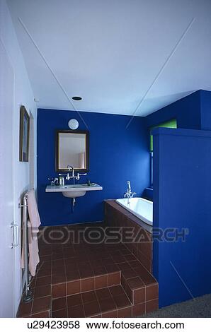 Stock Photo - Dark blue decorated bathroom. Fotosearch