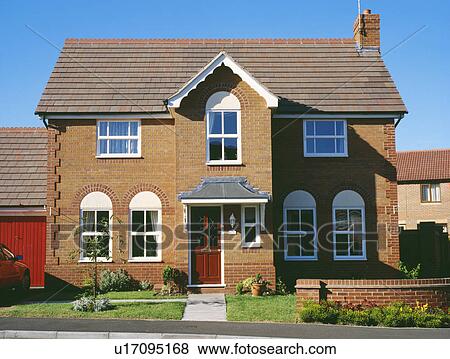 Detached newbuild traditional house View Large Photo Image Stock Photo - Detached newbuild traditional house. Fotosearch