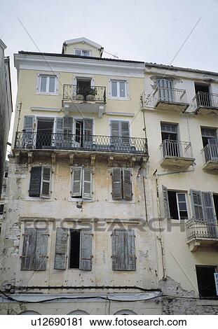 Dilapidated traditional terraced French town house with shutters View Large Photo Image Stock Image - Dilapidated traditional terraced French town house with shutters. Fotosearch