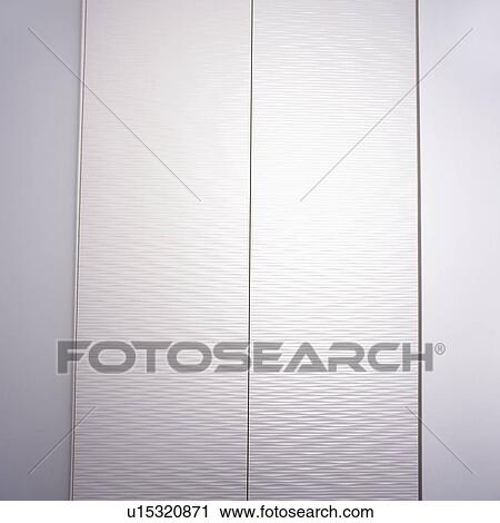 Doors closed on concealed white storage cupboard in alcove View Large Photo Image Stock Image - Doors closed on concealed white storage cupboard in alcove. Fotosearch