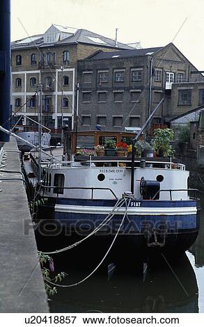 Dutch barge moored on river in city View Large Photo Image Stock Photo - Dutch barge moored on river in city. Fotosearch