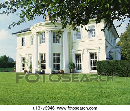 Exterior of grand colonial house with lawn in front. View Large Photo Image Stock Photograph - Exterior of grand colonial house with lawn in front.. Fotosearch