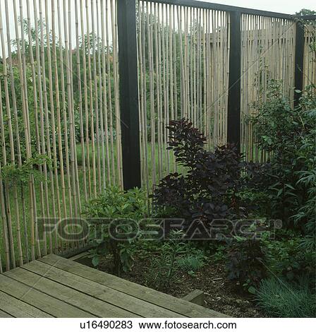 Fence in green country garden in summer View Large Photo Image Stock Image - Fence in green country garden in summer. Fotosearch