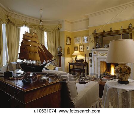 Fireplace in traditional country living room View Large Photo Image Picture - Fireplace in traditional country living room. Fotosearch
