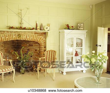 Stock Photo - Fireplace in traditional country living room. Fotosearch
