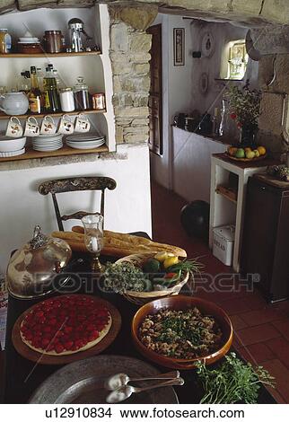 Picture - Food on the table in small cottage kitchen. Fotosearch