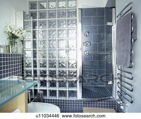 Fully tiled grey bathroom with glass brick shower screen View Large Photo Image Stock Photograph - Fully tiled grey bathroom with glass brick shower screen. Fotosearch