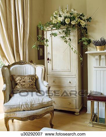 Georgian armchair and small cupboard in traditonal living room View Large Photo Image Stock Photo - Georgian armchair and small cupboard in traditonal living room. Fotosearch