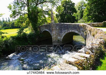 Georgian bridge over stream in garden at Iford View Large Photo Image Picture - Georgian bridge over stream in garden at Iford. Fotosearch