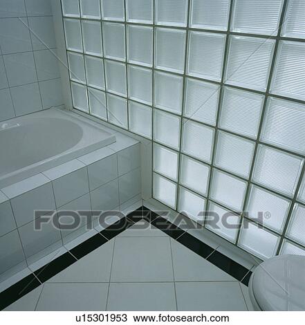 Glass Brick Wall And White Floor Tiles With Black Tiled Border