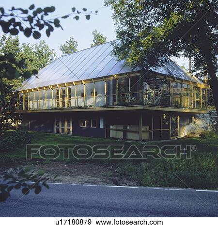Stock Photo - Glass veranda on ecological country house. Fotosearch