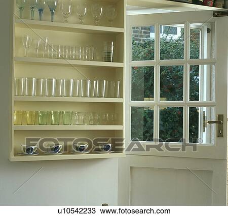 Glasses on shelves beside open half-glazed door View Large Photo Image Stock Image - Glasses on shelves beside open half-glazed door. Fotosearch