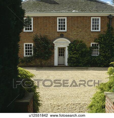 Gravel drive in front of traditional Georgian country house View Large Photo Image Stock Image - Gravel drive in front of traditional Georgian country house. Fotosearch