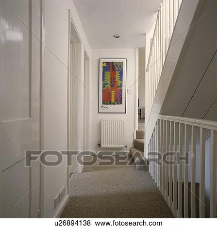 Grey carpet on white landing with grey carpet and colourful modern poster above white radiator View Large Photo Image Stock Photo - Grey carpet on white landing with grey carpet and colourful modern poster above white radiator. Fotosearch