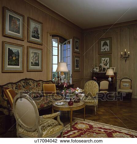 Group of pictures on wall iin panelled living room View Large Photo Image Stock Image - Group of pictures on wall iin panelled living room. Fotosearch