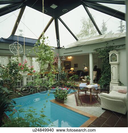 Indoor plunge pool with glass roof surrounded by rooms. View Large Photo Image Stock Image - Indoor plunge pool with glass roof surrounded by rooms.. Fotosearch