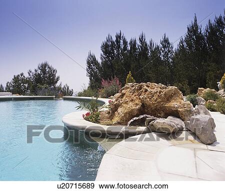 Stock Photo - Large curved swimming pool. Fotosearch