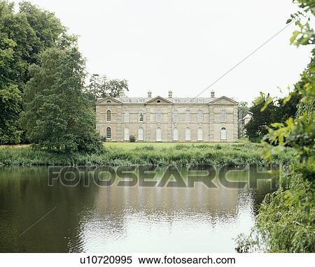 Stock Photography - Large Georgian country house beside a lake. Fotosearch