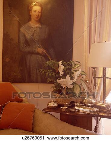 Stock Image - Large picture on wall in traditional living room. Fotosearch