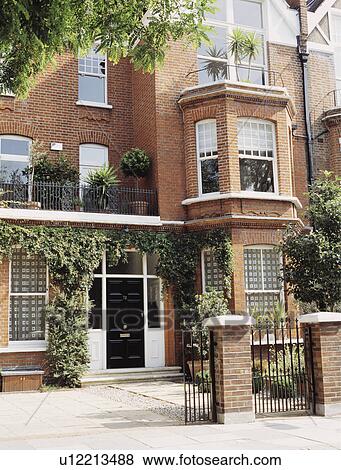 Large traditional Victorian brick semi-detached town house View Large Photo Image Stock Photo - Large traditional Victorian brick semi-detached town house. Fotosearch