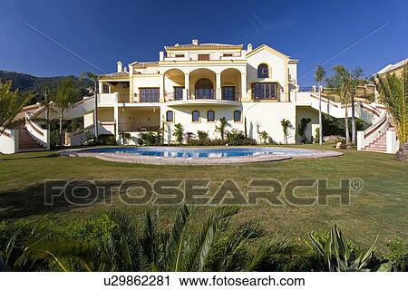 Large white newbuild Spanish villa with swimmingpool and lawn View Large Photo Image Stock Image - Large white newbuild Spanish villa with swimmingpool and lawn. Fotosearch