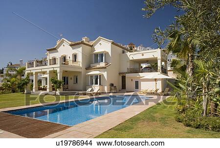 Large white Spanish villa with veranda and turquoise swimmingpool View Large Photo Image Picture - Large white Spanish villa with veranda and turquoise swimmingpool. Fotosearch