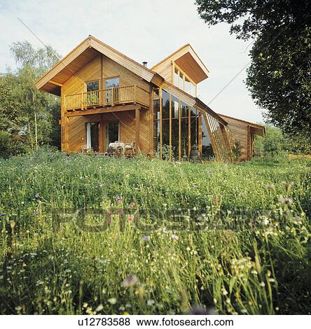 Lawn in front of modern country house in summer View Large Photo Image Stock Photo - Lawn in front of modern country house in summer. Fotosearch