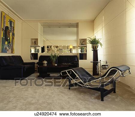 Le Corbusier chaise longue in modern white living room View Large Photo Image Picture - Le Corbusier chaise longue in modern white living room. Fotosearch