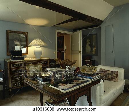 Lighted lamp in traditional grey living room View Large Photo Image Stock Photo - Lighted lamp in traditional grey living room. Fotosearch