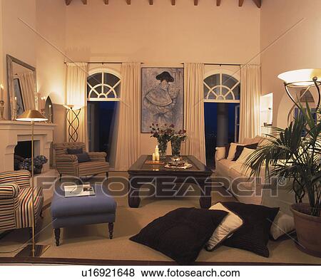 Lighted lamps in designer-style living room View Large Photo Image Stock Photo - Lighted lamps in designer-style living room. Fotosearch