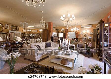Stock Photo - Lighting and furniture in interior decoration shop in Spain. Fotosearch