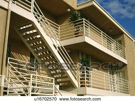 Metal exterior staircase and balconies on modern apartment building View Large Photo Image Stock Image - Metal exterior staircase and balconies on modern apartment building. Fotosearch