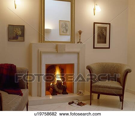 Stock Image - Mirror above fireplace in modern living room. Fotosearch