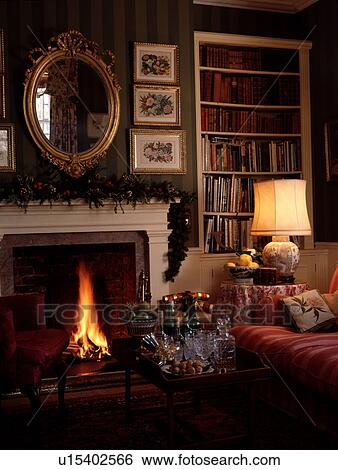 Mirror above fireplace in traditional living room View Large Photo Image Stock Photograph - Mirror above fireplace in traditional living room. Fotosearch