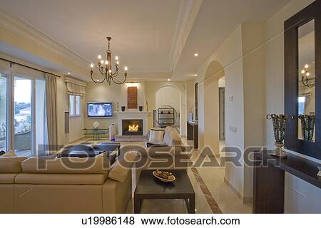 Modern apartment livingroom with chandelier and fireplace View Large Photo Image Stock Photo - Modern apartment livingroom with chandelier and fireplace. Fotosearch